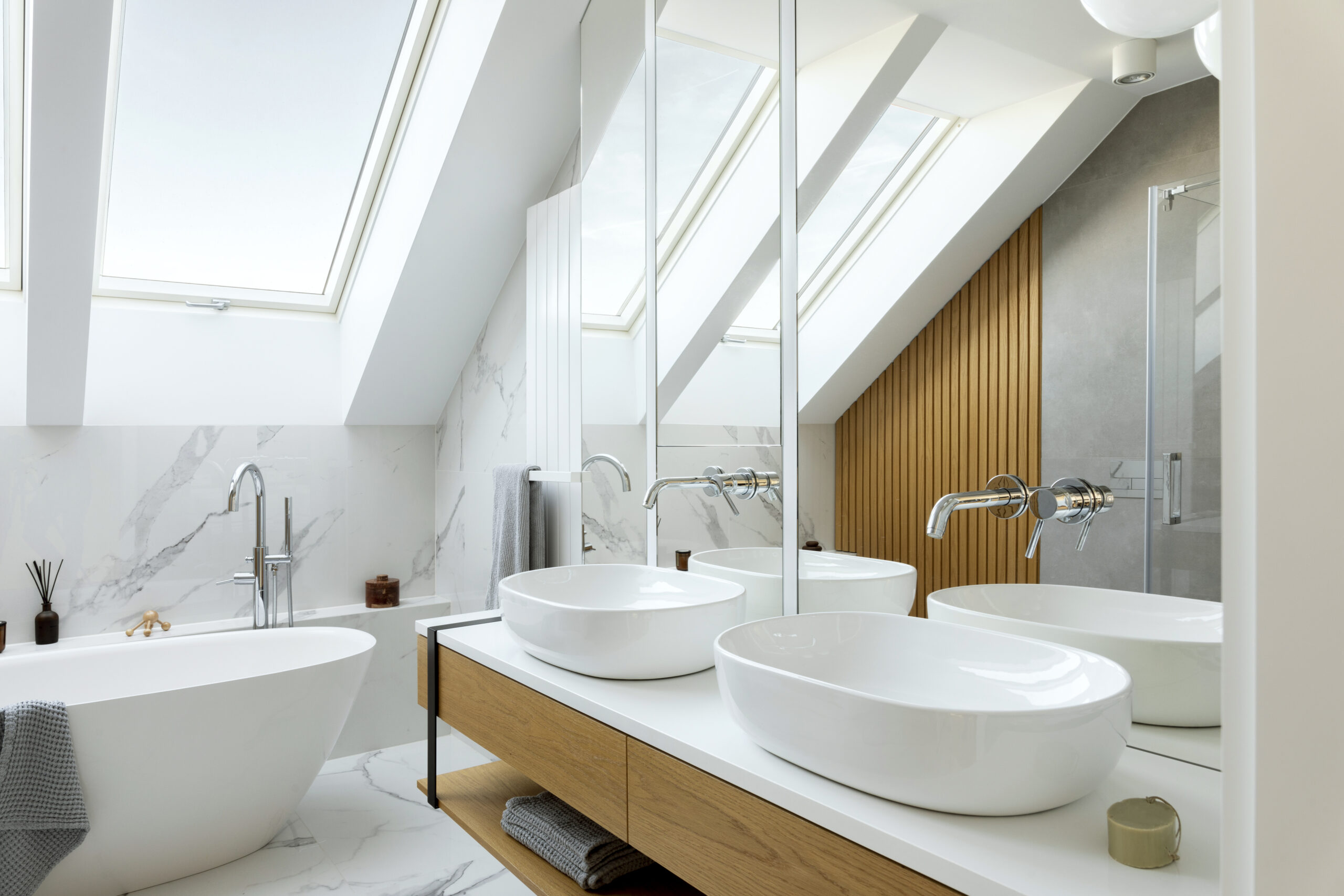 Stylish bathroom interior design with marble panels. Bathtub, to
